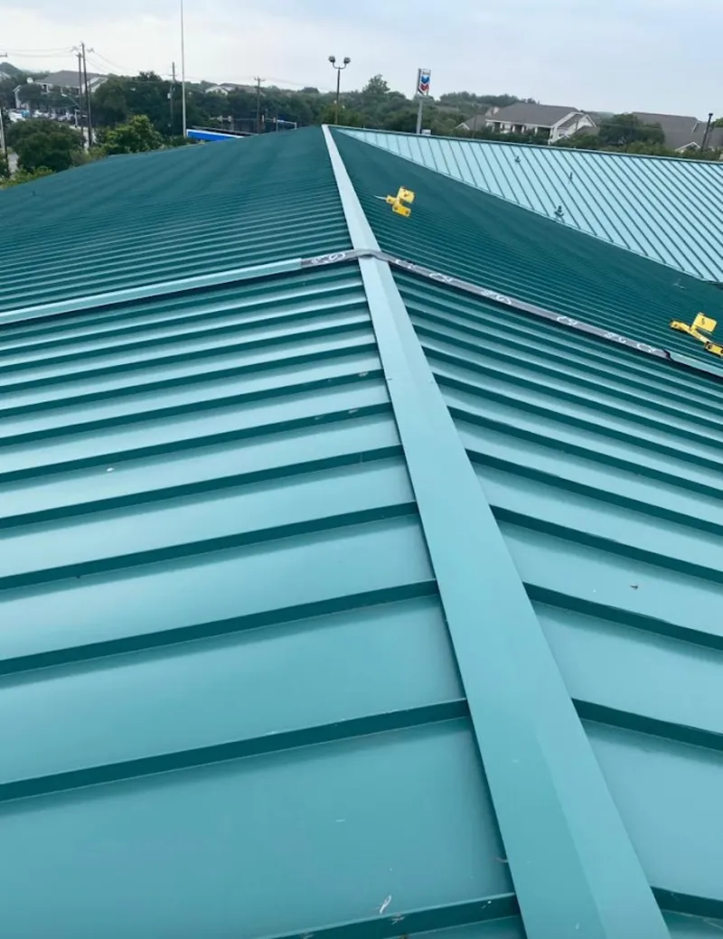 Green commercial metal roof ridge and valley for Metal Roof Repair in Alamo Heights